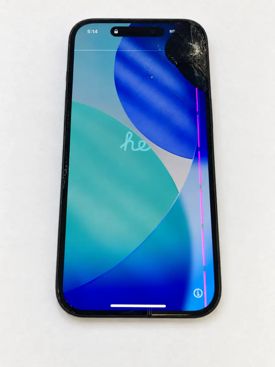 Cracked iPhone 15 screen with a pink vertical display line before replacement