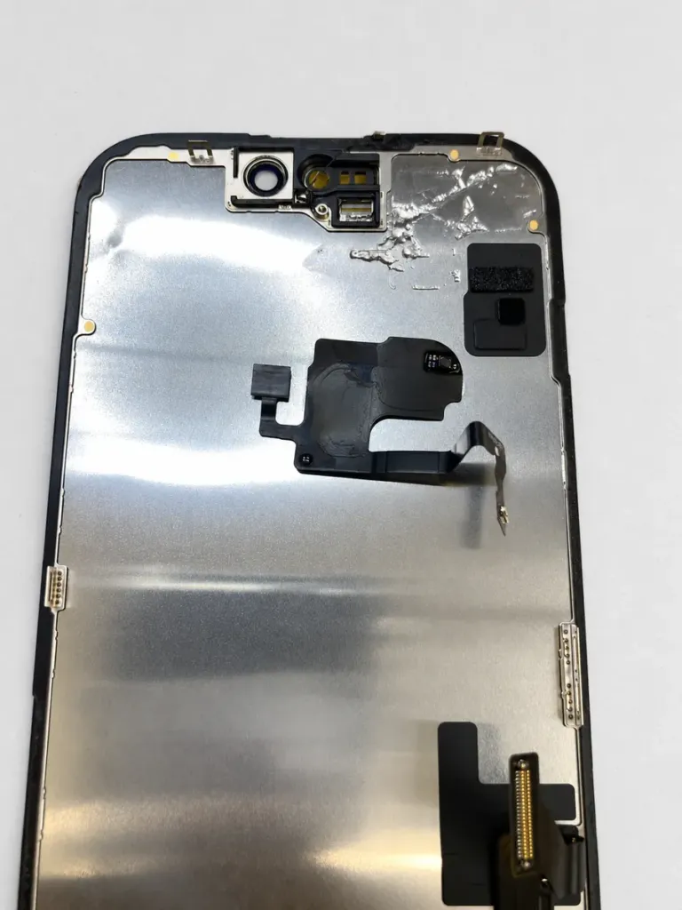 Original sensor flex assembly removed from the old iPhone 15 screen